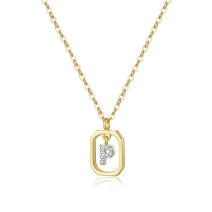 Macro shot of gold S925 silver necklace with a rectangular pendant and crystal letter P