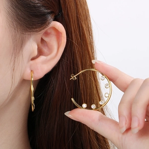 Fashionable gold C-shape stainless steel earrings with sparkling clear zircon accents