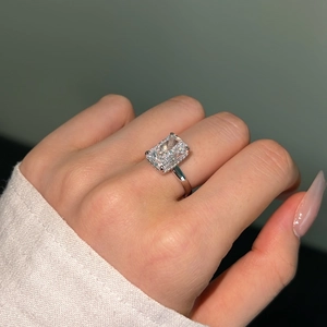 Detailed macro view of an S925 silver ring featuring a large radiant-cut clear gemstone