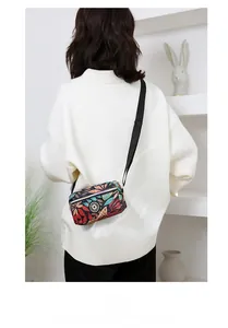 Detail of leaf pattern nylon crossbody bag with adjustable strap and sport logo