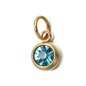 Close-up of a 6mm teal round zircon pendant set in a polished gold stainless steel frame