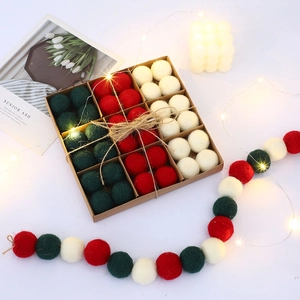 Handmade Christmas wool felt balls in red white and green for festive DIY decor