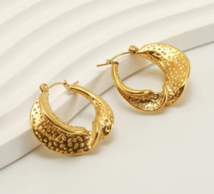 Detailed view of 18k gold plated stainless steel earrings with hammered texture finish