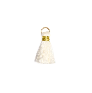 Detailed close-up of a white mini tassel pendant with gold thread and a metal jump ring