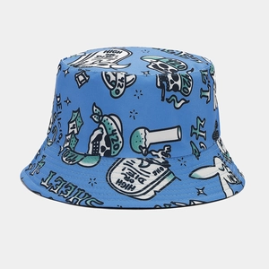 Macro detail of high-quality stitching and graffiti print on blue reversible bucket hat