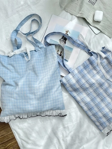 Niche plaid tote bag with white lace bow detail and ruffle hem in blue patterns