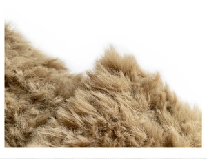 Close-up of the soft brown faux fur texture and knit details of this winter beanie hat