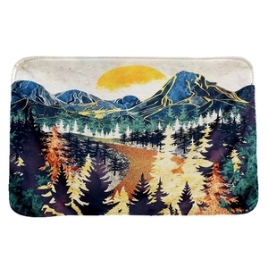 Absorbent flannel floor mat featuring a golden mountain landscape and sunset design