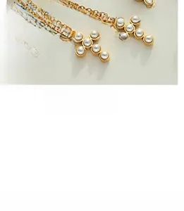 Detailed macro view of baroque gold-plated U-shaped ring with natural freshwater pearl inlay