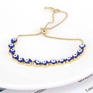 Detail view of the adjustable sliding clasp and golden chain on the Evil Eye beaded bracelet
