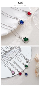 Détail macro de pendentifs en zircon coloré en forme de poire sur chaînes fines en titane