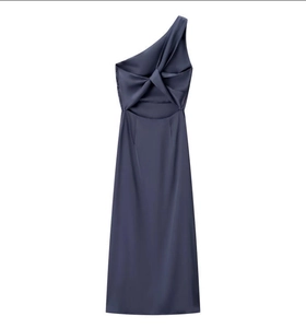 Detail of dark blue one-shoulder satin dress featuring a twisted knot and cutout back design