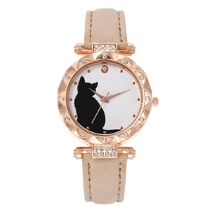 Detail of rose gold tonneau watch with black cat silhouette dial and crystal bezel