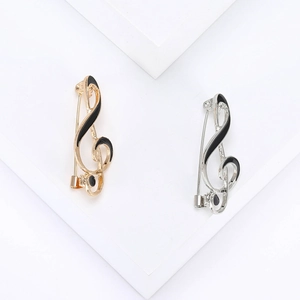 Minimalist musical note brooches in gold and silver alloy with black enamel finish