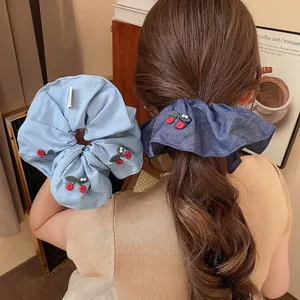 Knitted cherry pearl scrunchies for women in light blue and denim dark blue styles