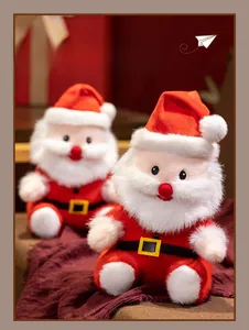 Close-up of plush Santa Claus dolls with red fabric and soft white fluffy texture