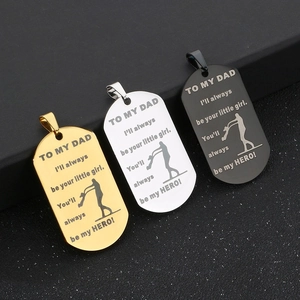 Detail of laser engraved stainless steel dog tags in gold, silver, and black colors