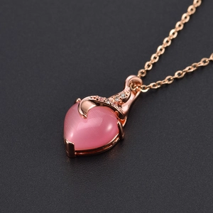 Rose gold heart necklace with a pink crystal pendant featuring elegant sparkling accents