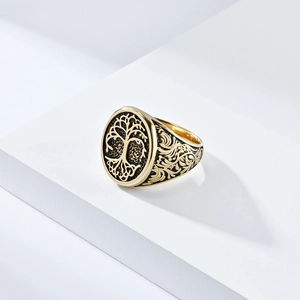 Vintage gold stainless steel signet ring featuring tree of life and vine carvings