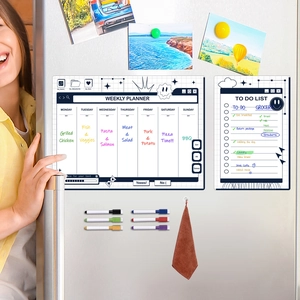 Magnetic weekly planner set with dry erase markers and eraser shown on a silver fridge