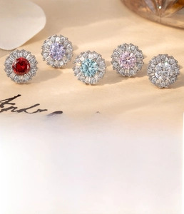 Macro detail of titanium steel stud earrings with colorful cubic zirconia halo clusters