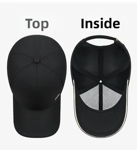 Detail view of the black baseball cap showing the top seam and mesh lining structure