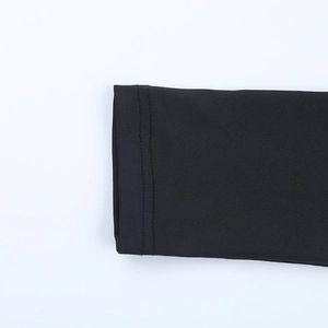 Detailed close-up showing double-needle stitching and hem on a black long sleeve top