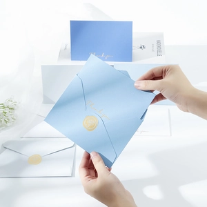 Elegant gold foil Thank You envelopes with rose wax seal in blue and navy paper