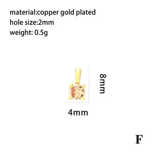 Detail showing an 18K gold-plated copper pendant with an orange cubic zirconia stone