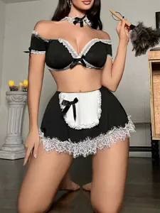 Detail of maid cosplay set featuring black ruffled crop top and white lace mini skirt