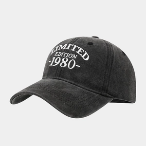 Detailed close-up of 1980 Limited Edition white embroidery on washed black cotton baseball cap
