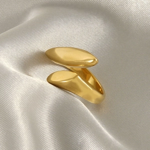 Irregular organic 18k gold plated stainless steel open ring on champagne silk background