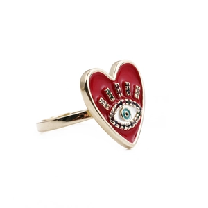 Detail of red enamel heart ring with blue evil eye and colorful zircon accents