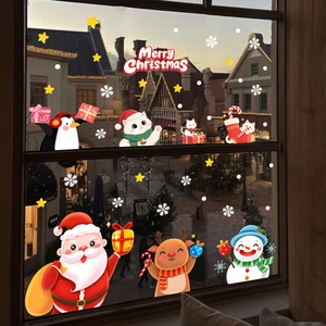 Cozy window display of Santa Claus, reindeer, and snowman static stickers for Christmas decor