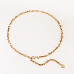 Close-up of golden metal chain belt featuring a sun and moon smiley face pendant charm