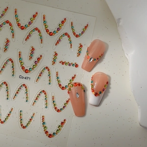 Macro shot of colorful U-shaped rhinestone nail art stickers with model Co-471 detail