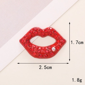 Macro detail of red rhinestone lip charm with size dimensions and weight specifications