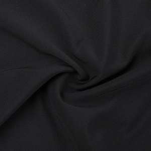Close-up of black knitted fabric texture showing fine elastic fibers and soft material