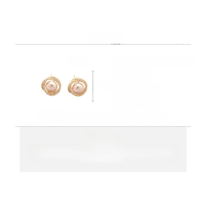 Detailed view of round gold earrings with zircons and pink pearls including dimensions