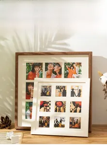 Detailed view of walnut wood frame with nine-grid white mat board and natural shadows