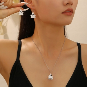 Detail shot of cute white ghost necklace and earrings set on model for Halloween