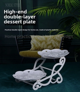 Detail of white double-layer plastic dessert stand with elegant petal edge trays