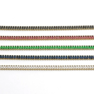 Detail shot of double-layer stainless steel bracelets in five vibrant color variants