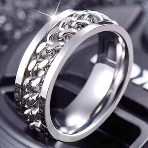 Close-up of polished silver rotatable chain ring with hip-hop style bottle opener design