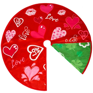 Detail of reversible holiday tree skirt showing red heart print and green clover side
