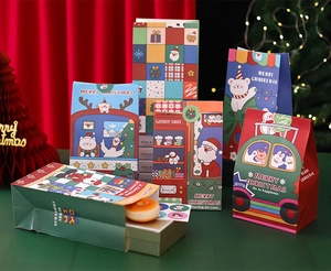 Detail of assorted Christmas gift paper bags with festive prints on a red velvet background