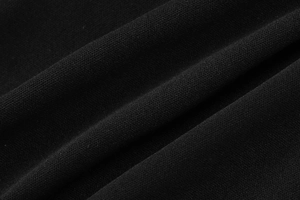 Close-up of the black ribbed fabric texture showing the premium material and fine stitching