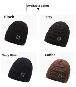 Close-up of knit winter beanies with R-letter labels in black, grey, navy, and coffee