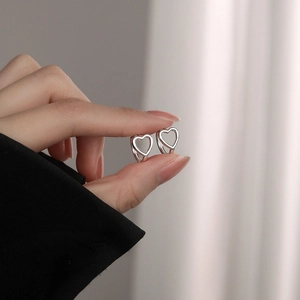 Elegant S925 sterling silver hollow heart hoop earrings for women in a minimalist style