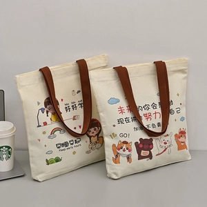 Cute canvas tote bag with cartoon bear print and durable brown handles for students